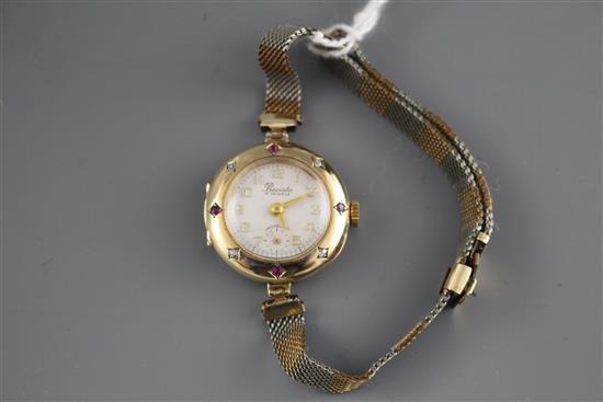 A ladys mid 20th century 14k, ruby and diamond set Precista manual wind dress wrist watch, on rolled gold and steel bracelet.